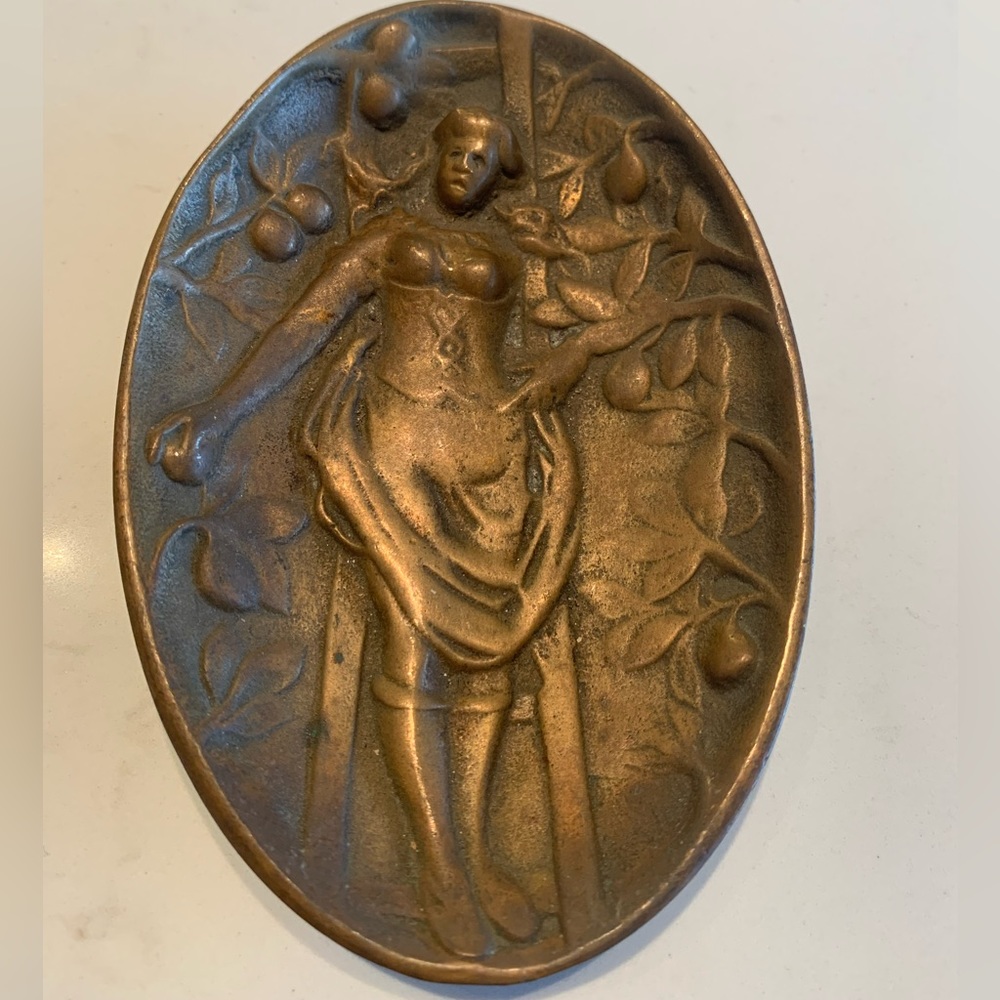 Vintage brass dish woman on ladder, reverse is her derrière. Playful/ris…
